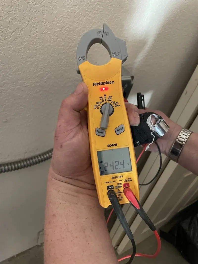 Voltage testing with clamp meter during Outlet Installation in Elsmere